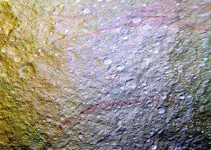 "Red Arcs on Tethys" by NASA. Public domain.