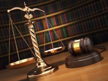 justice concept. gavel,  golden scales and books in the library with dof effect.  3d