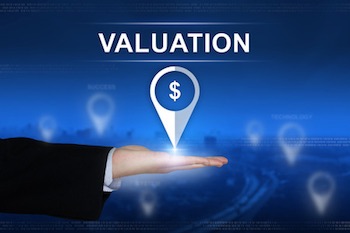 IP market, financing - Financial valuation button with business hand on blurred background