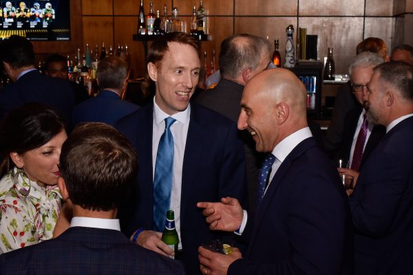 Richard Lloyd (facing center) shares a laugh with Matteo Sabattini of Ericsson.